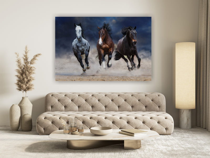 Horse herd run free on desert dust against storm sky